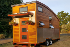 The Metro Tiny home on wheels completed shell, steel bracketed covered porch