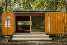 c320 Lookout shipping container home in wooded setting